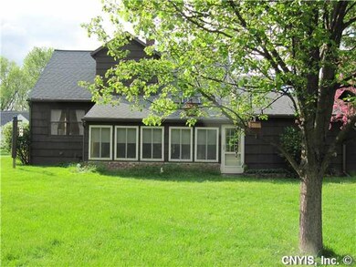 Exterior Back. Back of home shows large bathroom t