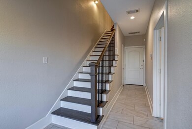 Staircase leading to the living room and kitchen