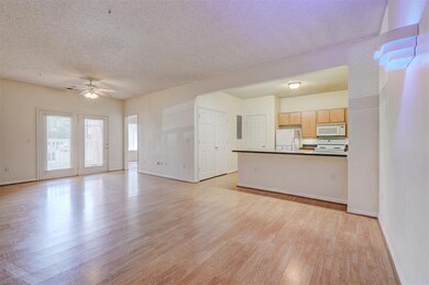 Unfurnished living room featuring ceiling fan, lig