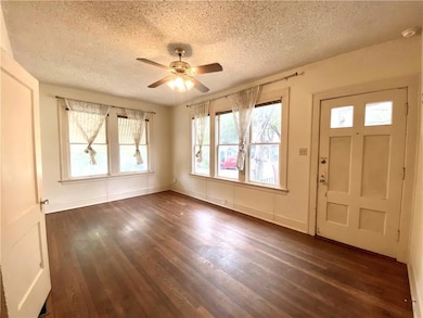 Entrance foyer with a textured ceiling, a ceiling