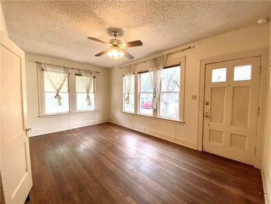 Entrance foyer with a textured ceiling, a ceiling