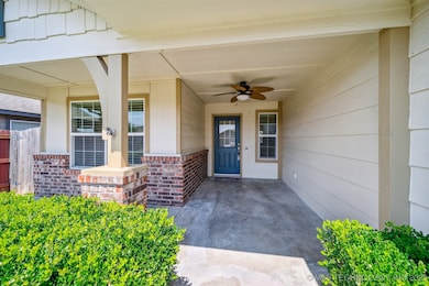 Covered front porch with room for a swing our furn