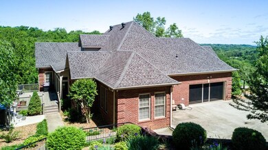 Side view of home with screen cover to attached garage