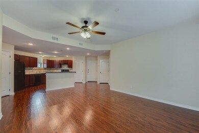Unfurnished living room with ceiling fan and dark