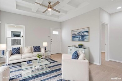 Living area with ceiling fan, beam ceiling, baseboards, coffered ceiling, and recessed lighting