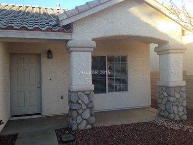 Property Photo. Covered Stone Entrance