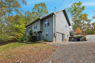 Front view of property featuring stairs, a metal roof, and a wooden deck