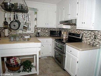 Kitchen - Work area of kitchen with island, pot ra