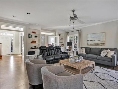 Spacious family room with built-ins and crown mold