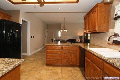 Kitchen is open to large dinette/family room. Hall