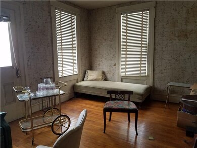 Beautiful hardwood floors shine in the parlor