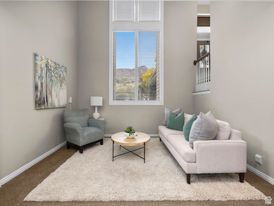Living area featuring carpet flooring and plenty of natural light
