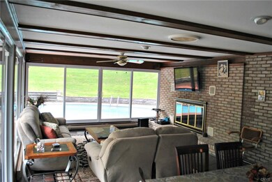 Glass walled family room w/ built-in grill, gas lo