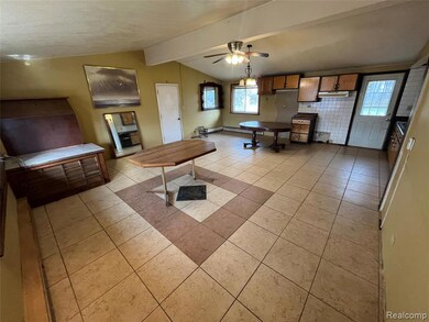 Large open living area with ceramic tile flooring
