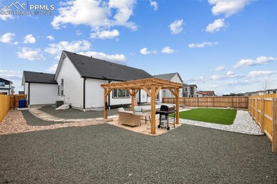Rear view of house with a pergola, cooling unit, a fenced backyard, and a patio