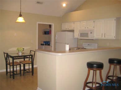 The eat-in kitchen with bar seating as well.