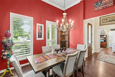 Dining space with a chandelier, wood finished flo