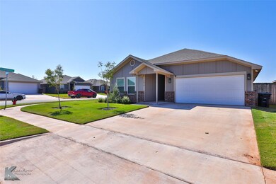 View of front of home featuring a garage and a fro