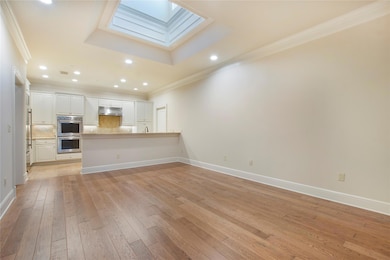 Unfurnished living room with light hardwood / wood