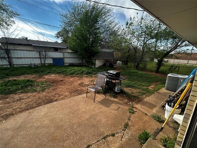 View of yard with central AC unit, a patio area, a