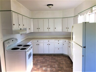 Plenty of counter space and cabinets in the kitchen.