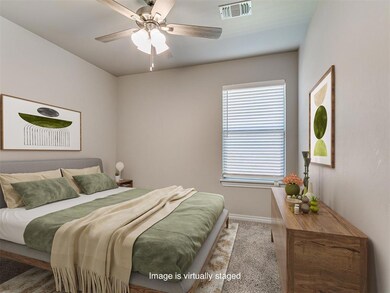 Bedroom with baseboards, a ceiling fan, and carpet floors