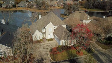 Aerial view showing the pond and fountain in the b
