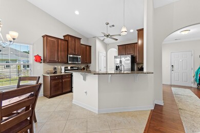 Kitchen featuring a breakfast bar area, appliances