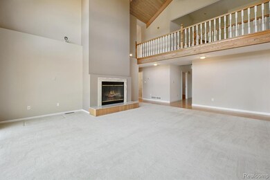 Unfurnished living room featuring high vaulted ceiling, light colored carpet, a fireplace, and wooden ceiling
