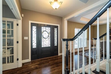 Recently refinished hardwoods welcome visitors.