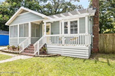 Pergola roof hangs over porch