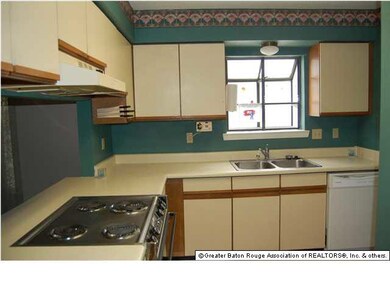 Kitchen features laminate floor, good counter spac