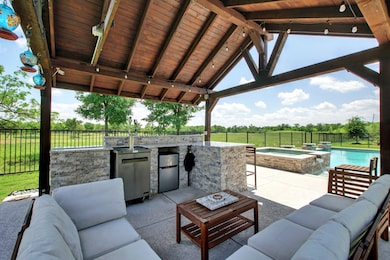 Fenced backyard featuring an outdoor hangout area