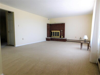 Large living room with brick fireplace