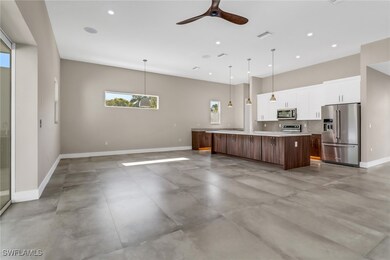 Kitchen with stainless steel appliances, white cab