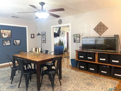 Front room of home currently used as dining.