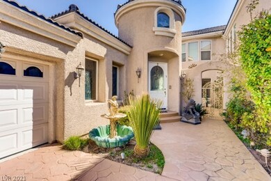 Stamped concrete driveway and entrance with gated