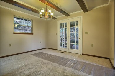 The dining room offers beautiful wooden beams and 