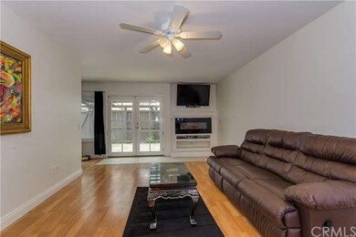 Laminate floors and modern electric fireplace in t