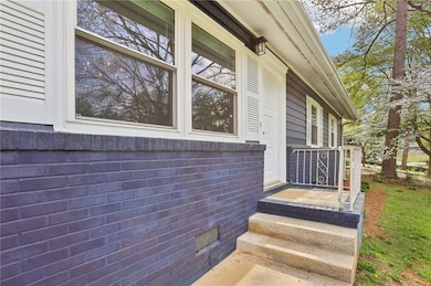 Doorway to property featuring crawl space
