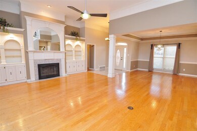 A gas log fireplace highlights the family-sized gr