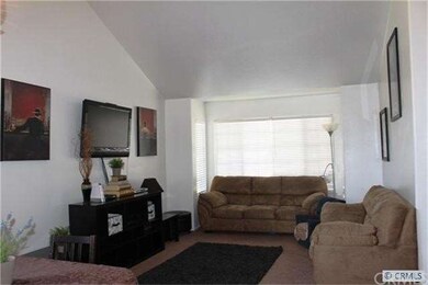 FORMAL LIVING ROOM OPEN TO THE FORMAL DINING ROOM 