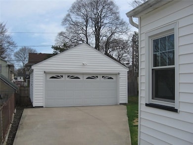 CONCRETE DRIVEWAY WITH TWO CAR GARAGE