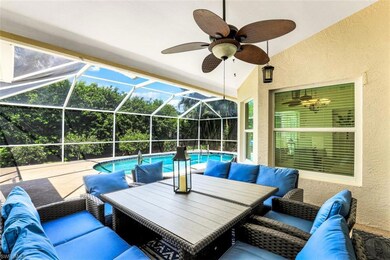 View of patio / terrace with a lanai, ceiling fan,