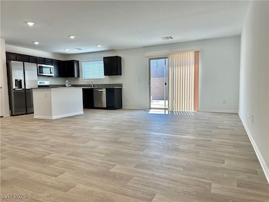 Kitchen featuring appliances with stainless steel
