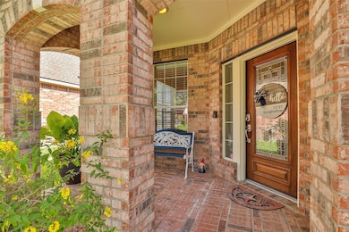Beautifully bricked front porch welcomes you home.  Extra space for a bench or rocking chairs.