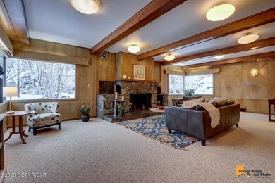 Huge windows frame the fireplace
