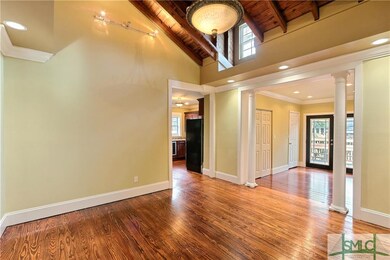 Wood floors continue through the dining room and i