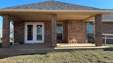 Property entrance with a patio