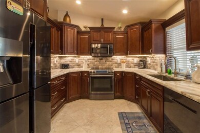 Kitchen features high end wood cabinets, stainless